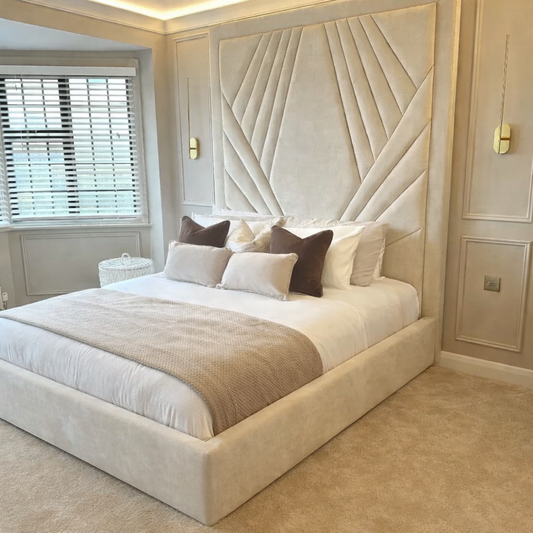 The Destiny Luxury Bed in cream upholstery styled in modern bedroom interior.
