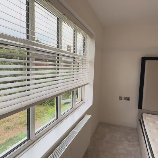 Close-up of The Border luxury bed headboard with detailed border upholstery