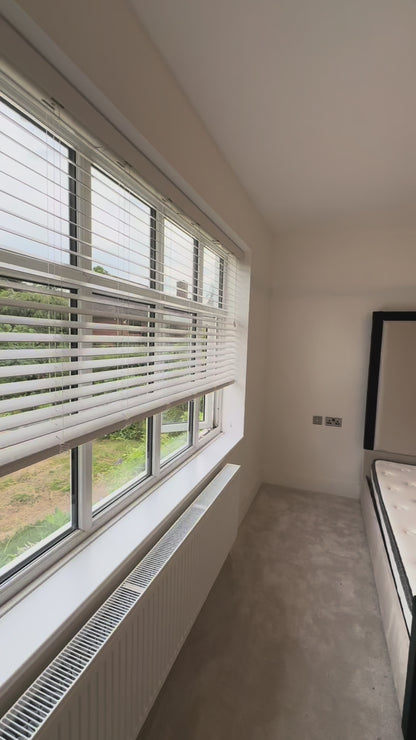 Close-up of The Border luxury bed headboard with detailed border upholstery
