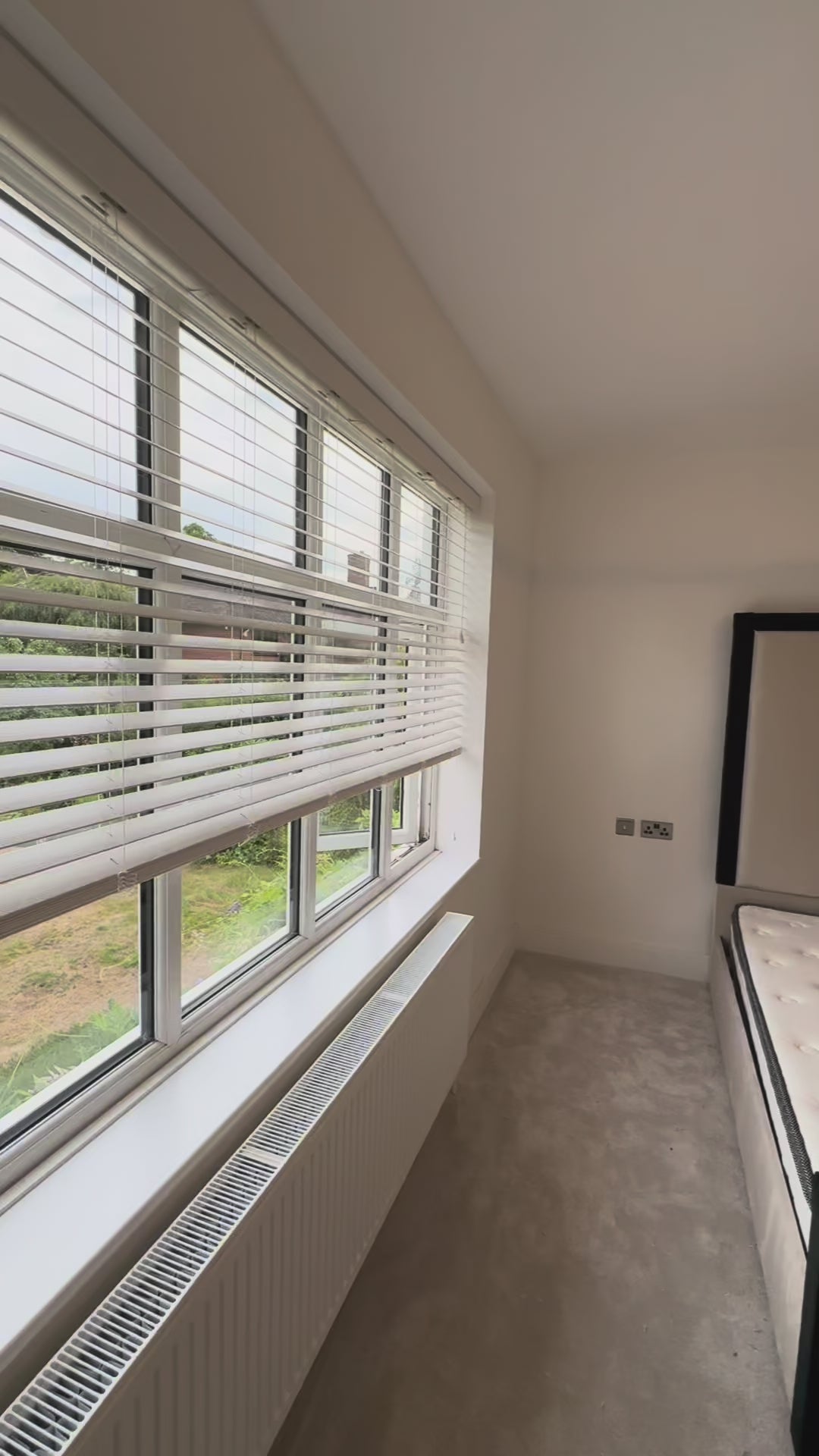 Close-up of The Border luxury bed headboard with detailed border upholstery